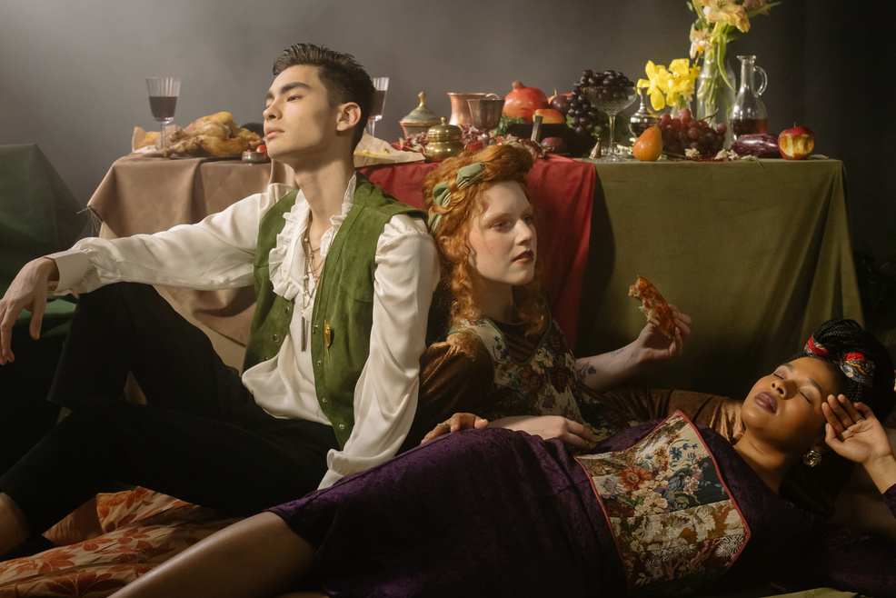 People Sitting on the Floor Near the Dinner Table